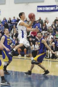 VUHS Junior Guard Charlie Stapleford goes for the hoop and helps his team move closer to the goals of the season.