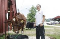 Allison Levasseur waters one of her dad’s milking short-horn cows during a very humid Thursday Afternoon at Addison County Fair & Field Days. Rain later in the day during a thunderstorm brought minor relief. Field Days was again well attended this year.