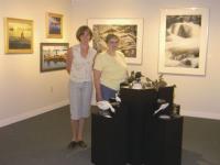 Sue Potter of the Lake Dunmore Fern Lake Association and Edgewater Gallery manager Bay Jackson pause in the midst of the new show titled On the Water that will run at the gallery from August 18th-August 26th featuring the works of artists that call Lake Dunmore and Fern Lake home.