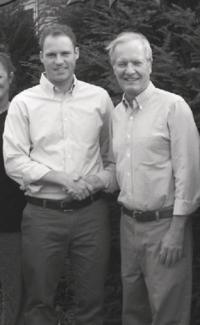 Greg Maurer shakes hands with the new dentist in town, Dr. Derek Cimler who purchased his practice on New Haven Road in the Little City.