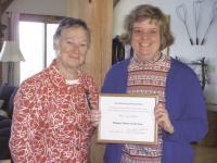 DAR member Liz Bicknell presents DAR Chapter Citizen of the Year Susan Ferland with her award