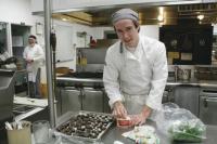 Timmy Johnston a Senior in the Culinary Arts curriculum at the Hannaford Career Center in Middlebury prepares stuffed mushrooms and other horderves for his guests during the Open House on Thursday February 7, 2013.  All 18 programs and their student participants and teachers were available to show visitors individual areas of study.  The annual event is always well attended and gives the community an opportunity to interact with dozens of bright and talented young students as they create a career path for their future and the future of their community.