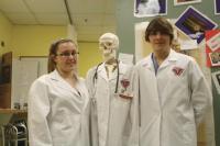 Yvette Blair and Kyle Korda both Juniors in Instructor Rita Wells Rn MSN class take time for a quick picture with Mr. Bones before greeting firends, parents and visitors to the annual Open House evening at the  Hannaford Career Center on Thursday, February 7, 2013. Yvette and Kyle are part of a growing number of students throughout the  country who are studying for a career in health care while still in high school and Hannaford offers them excellent opportunities to do so. Health professions is now a full day program at the school providing even more experience and hands on knowledge for the students enrolled. 