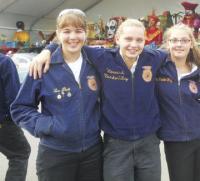 During the 2012 Big E parade Abbie Stearns, Jenna Rao, Mikayla VanderWey pause to enjoy the moment.