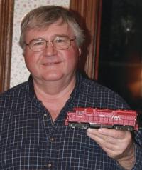 Jeddie Martin IV holds a model of one of the many trains he worked on during his 40 plus year career with the Vermont Railroad. Jed, like his father, held just about every position in the company before his retirement.