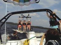 Parasailing is just one of the amenities included at “Saranac Village”, the Young Life camp on Upper Saranac Lake.