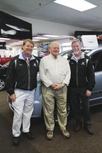 Together in business and bonded by family, Ed stands with sons Scott and David who today represent the third generation owners of Foster Motors.