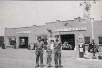 Standing between the two original owners of Person & Foster Motors, six year old  Ed Foster stands in front of what today is Foster Motors and represents over forty years of his life’s work.