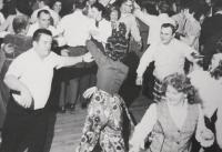 Rita grew up loving to dance and loving to be around people. Today both hold true. Seen here in the front right of the photo, Rita, her siblings and neighbors joined together at the Old Town Theater in Middlebury for a holiday party