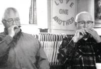 Making music was always a part of the family's time together on the farm.  Here father Louie and son Louie II join in together on the harmonica at Louie's 90th birthday celebration.