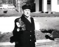 Bill Larrabee stands at his McDonough Drive home with a sextant from his WWII years.