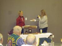 LtoR: Maryanne Castimore receiving check from President Shanon Atkins.