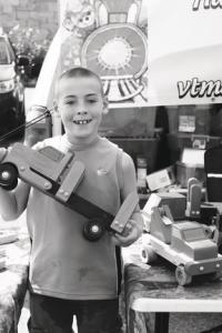 Issac helps grandfather Steve Eastman at Farmer's Market