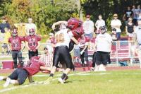  Justin Stone delivers a crushing  tackle on CVU Quarterback James Whitaker. 