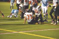 Cullen Hathaway #37 recovers a fumble at the 2 yard line causing a big momentum swing in the first quarter of Middlebury’s win against So. Burlington as #11 Connor Quinn looks on.