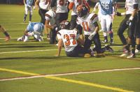 Cullen Hathaway #37 recovers a fumble at the 2 yard line causing a big momentum swing in the first quarter of Middlebury’s win against So. Burlington as #11 Connor Quinn looks on. 