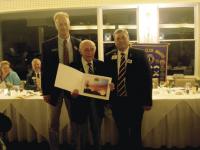 Vergennes Lions Club President, Tim Cowan (on the left) and International Director Ed Farrington (on the right) presenting Charter Member Robert Barrows with an
