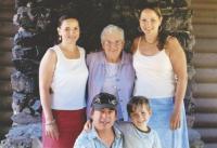 Standing with family, Ruthie's smile explains her formula for a meaningful life. Work hard, love your family a ton and never stop appreciating the land, animals, people and the little things in life.