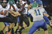 Tigers Trey Kaufman #43 lines up Colchester #11 Justin Evans for short gain as another defender Ben Shepherd attempts to strip the ball. Tigers won with three 4th quarter td’s by Kaufmann 18-14