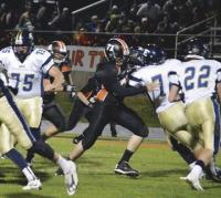 Tiger’s #77 Maverick Payne fights off a block to grab Essex ball carrier.