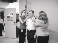 Brad Howe getting his Chief Master Sergeant stripes with daughters Christina on left and Carrie on right in June of 2002.