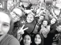 A selfie taken on the Junior Class Float during the homecoming parade. Both German and American students are having a blast!