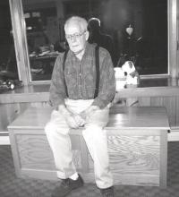 Sitting on one of the beautiful wooden chests he made, Bob Douglas is getting ready to celebrate a special birthday and have an Open House from 4:00-7:00 p.m. on November 6th!!