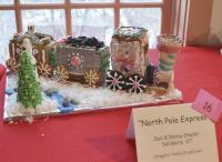 #16 “North Pole Express” 
Destination Yummy.  This is a train with a cargo of Holiday Cheer for all to enjoy.  The train has a little engine that can make you smile and is part of the Vermont Folklife Center's annual Holiday display for 2015.  Created by: Sue & Darcy Stoats of Salisbury, Vt.
