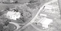 Taken by a photographer from the air, this farm shot has Marie pausing on the road to see what was going on and even Russell on the tractor looks up to see the commotion. 