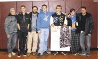 Coaches and VUHS Wrestlers pause to celebrate a successful tournament in Maine.