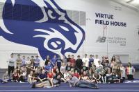 Stopping for a photo in front of the Middlebury College mascot, the 8th graders from Team Endeavor were very thankful to be able to start their unit with the Jesse Owens-1936 Olympic Games recreation at the Middlebury College Indoor Track facility.