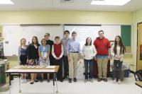 Gathered just before the Capstone Project presentations began, some members of 8th grade Team Endeavor smiled for the camera. ( L-R) A. MacKinnon, E. Brouillard, V. Provencher, A. Chamberlain, K. Williams, A. Gardner, I. Brons, H. Cauchon,  G. Grady and C. Austin are ready to go after weeks of work!