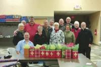 Local members wrapping gifts for meals on wheels’ recipients.