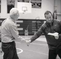 Mt. Abe Varsity Wrestling Coach Nick Mayer congratulates Rod Cousino for his years at the helm of the program.