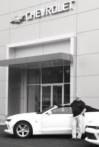 Tom Denecker in front of the new building.