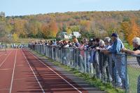 Tiger fans line the fence to root on the Tiger at CVU.