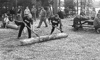 Morin and her teammate compete in the log rolling competition. This timed contest involves rolling the log off the landing and over to two posts. The log must touch the posts and then be rolled bac and up the ramp to the top of the landing. Three teams of two compete with a log. Once the last log hits the top of the landing the time stops.