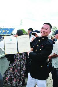 Sueyen Chung celebrates his graduation from the US Naval Academy.