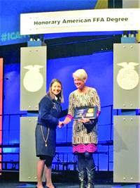 Suzanne Buck receiving her award at the national FFA conference.