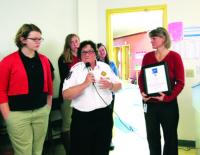 Joanne Reynolds a veteran who is a member of the Middlebury VFW presented an appreciation award  to CVCS thanking them for their annual Veterans Day Ceremony.