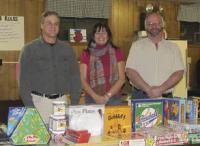 Picured above: Bill Devoid, Deb Hall and Barry Tracy. Boys and Girls Club Program Director Deb Hall accepts a donation of items from Dorchester Lodge #1. The Boys and Girls Club continuies to meet in th building owned by the Masonic Association.