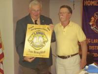 Past International Director Tom Broughton receiving a thank you plaque from Vergennes Lion Gary Russell.