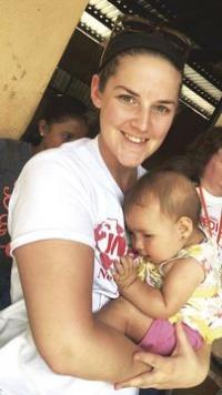 Shelby Sheehan pauses a moment with one of the children she worked with during the mission.